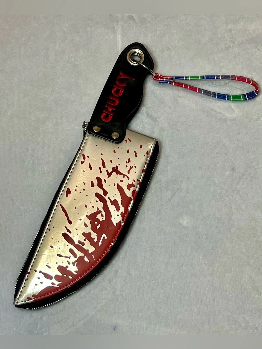 Spencer's Silver & Red Chucky Phone Case Pouch with Keyring Strap